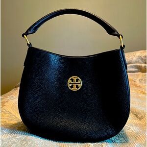 Tory Burch black top handle handbag. Brushed gold hardware with crossbody strap